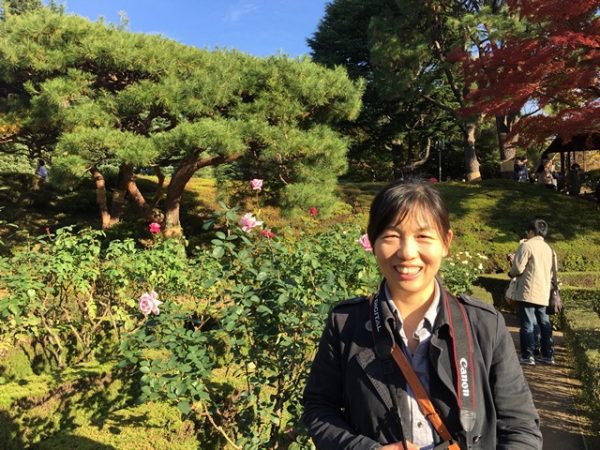 Metropolitan Gardens : 東京都故園, Japanese Culture, A beautiful Chinese woman modeling at the rose garden at Kyu-Furukawa gardens with rose bushes, pine trees, and red maples in the background.