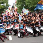 YOSAKOI Soran Festival in Sapporo Dancers Posing for a Group Photograph. They are all wearing blue dancing yukatas.