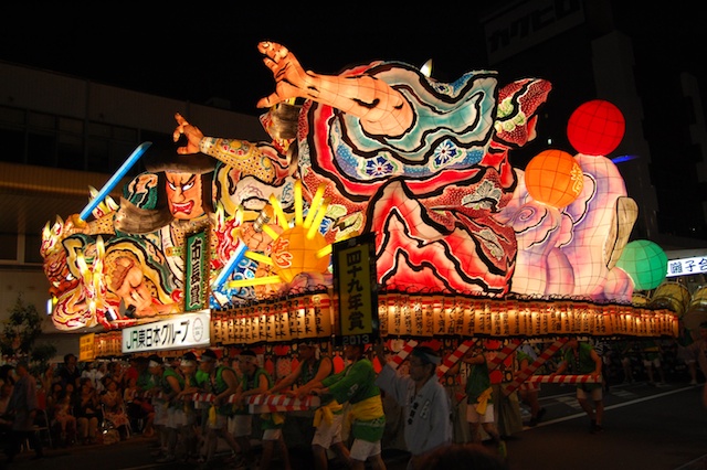 Japanese Culture, A huge lit-from-within float carried by people down the street in Aomori city.