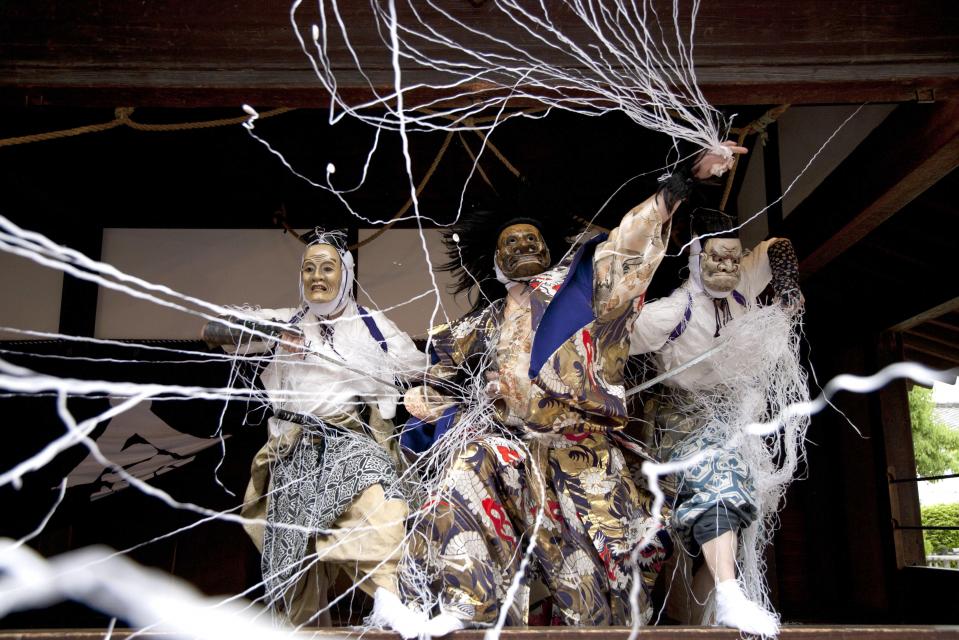 Actors performing Buddhist moral plays called Mibu Kyōgen near Kyoto.