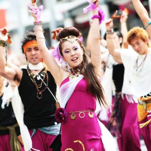 Japanese Culture, Yosakoi Festival, Yosakoi dancers performing with purple, white and black costumes at the Yosakoi festival in Kochi city.