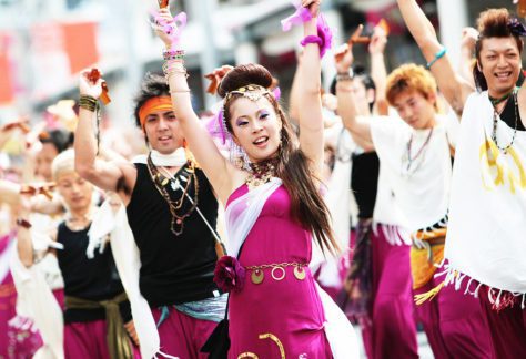 Japanese Culture, Yosakoi Festival, Yosakoi dancers performing with purple, white and black costumes at the Yosakoi festival in Kochi city.