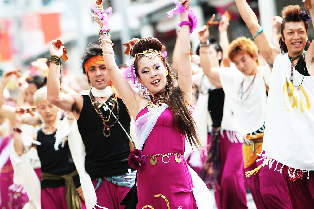 Japanese Culture, Yosakoi Festival, Yosakoi dancers performing with purple, white and black costumes at the Yosakoi festival in Kochi city.