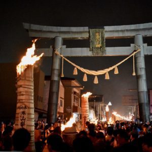 Japanese Culture, Giant three meter tall pine wood torches ablaze in front of FujiYoshida Sengen Shrine.