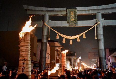 Japanese Culture, Giant three meter tall pine wood torches ablaze in front of FujiYoshida Sengen Shrine.