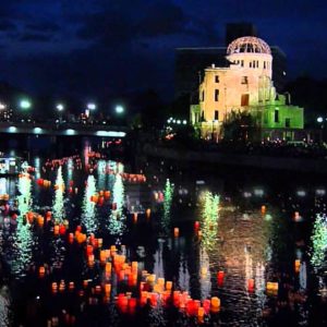 Lanterns floating down the river beside the Atomic