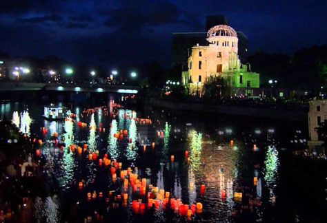 Lanterns floating down the river beside the Atomic