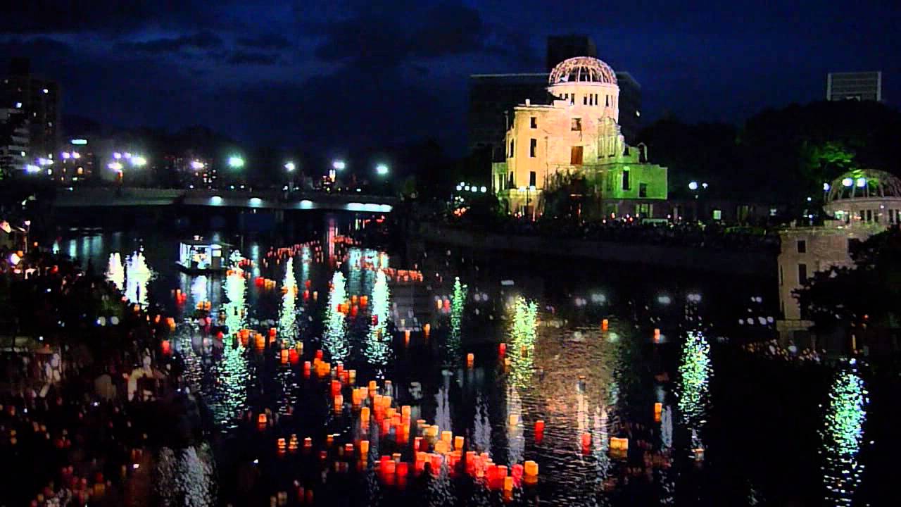 Lanterns floating down the river beside the Atomic