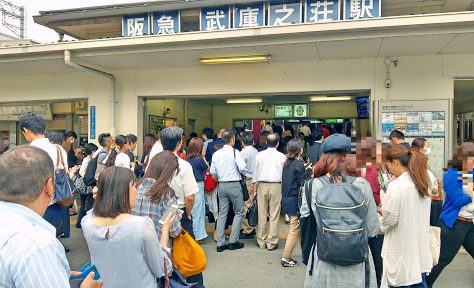 Japanese Culture, December in Japan, People in front of a train station somewhere in Japan. Goyosame., December in Japan