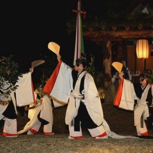 Japanese Culture, December in Japan, Traditional Japanese dancers wearing Heian era kimonos performing a ritual at night. Kasuga Wakamiya On-Matsuri, December in Japan