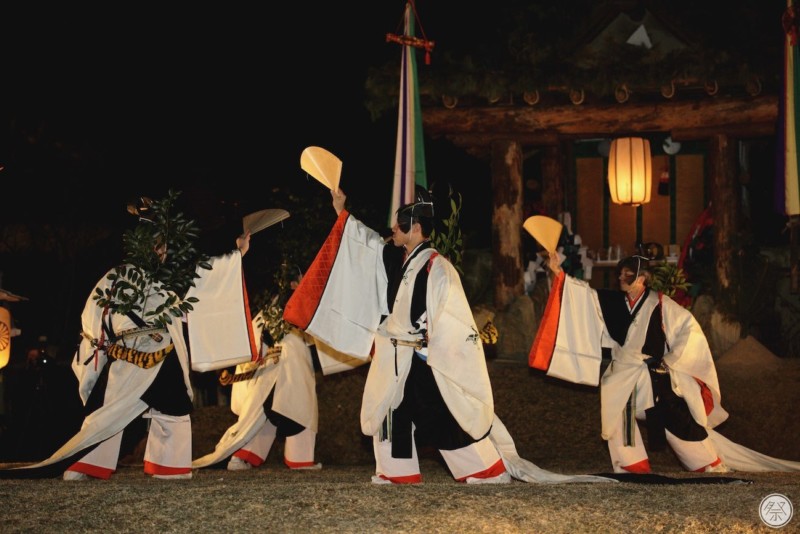 Japanese Culture, December in Japan, Traditional Japanese dancers wearing Heian era kimonos performing a ritual at night. Kasuga Wakamiya On-Matsuri, December in Japan