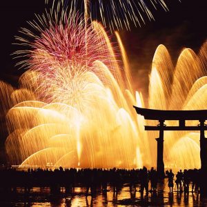 Japanese Culture, Omisoka. People watching, December in Japan fireworks at Miyajima shrine on New Year’s Eve.