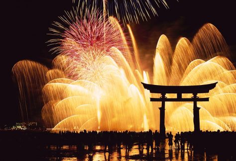 Japanese Culture, Omisoka. People watching, December in Japan fireworks at Miyajima shrine on New Year’s Eve.