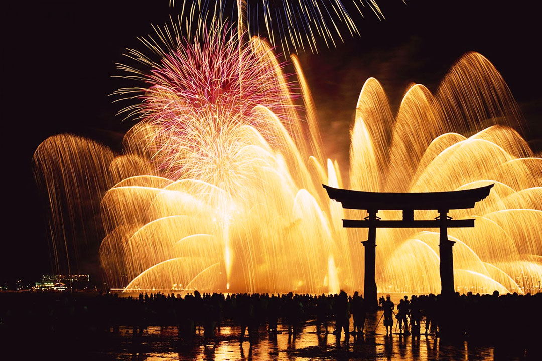 Japanese Culture, Omisoka. People watching, December in Japan fireworks at Miyajima shrine on New Year’s Eve.